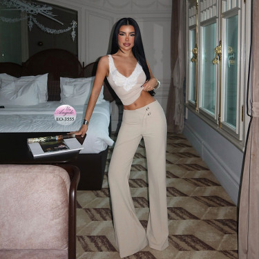 Elegant women's trousers with a wide belt, buckles and flared leg