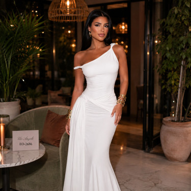 Long white dress with an asymmetrical neckline, dropped shoulder and twisted elements