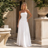 A long white strapless dress with a low waist and an ethereal chiffon skirt